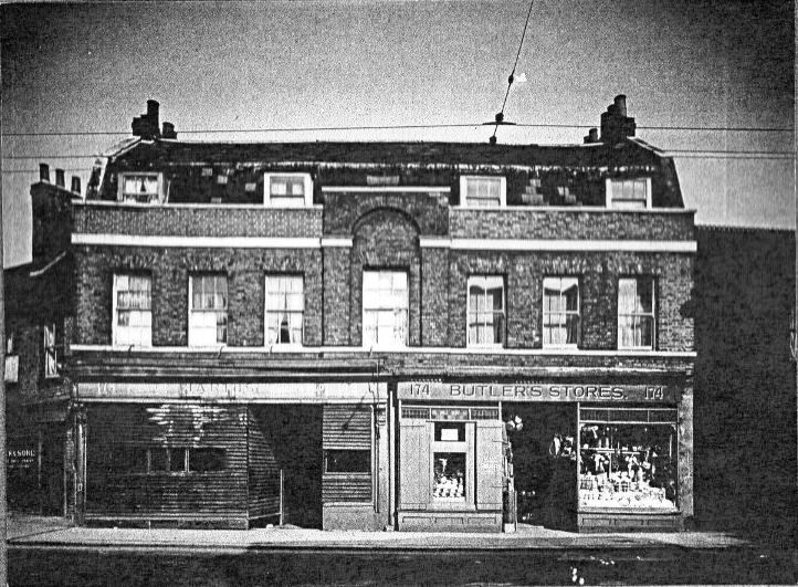 view showing two storey brick built property, used as two shops