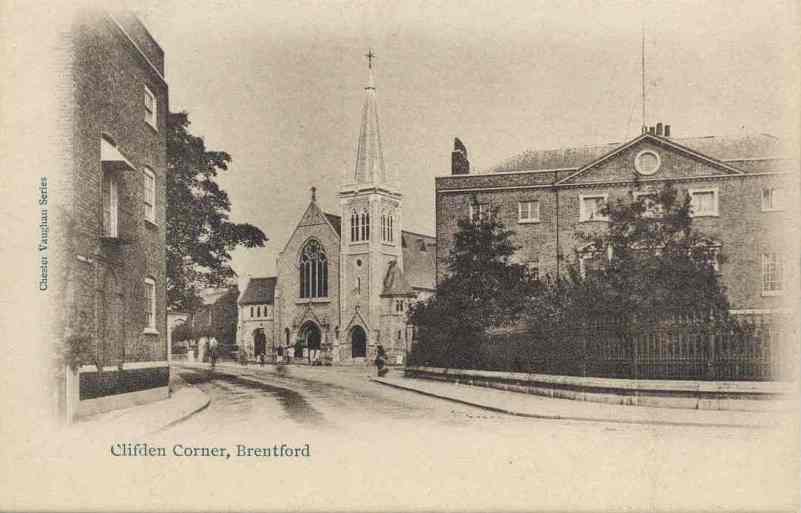 Sepia postcard of church and surrounding buildings