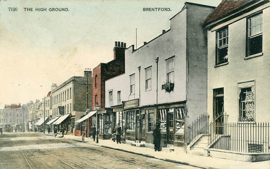 Quiet street scene titled 'The High Ground'