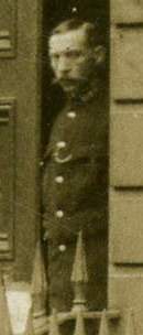 Policeman standing in doorway