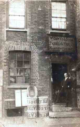 View outside same premises: Arthur John Dawes with a range of baskets