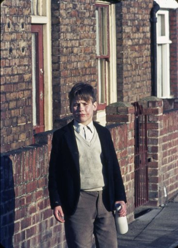 Boy delivering milk