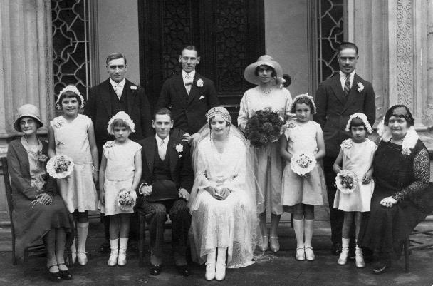 Wedding group of 12, outside a grand looking entrance