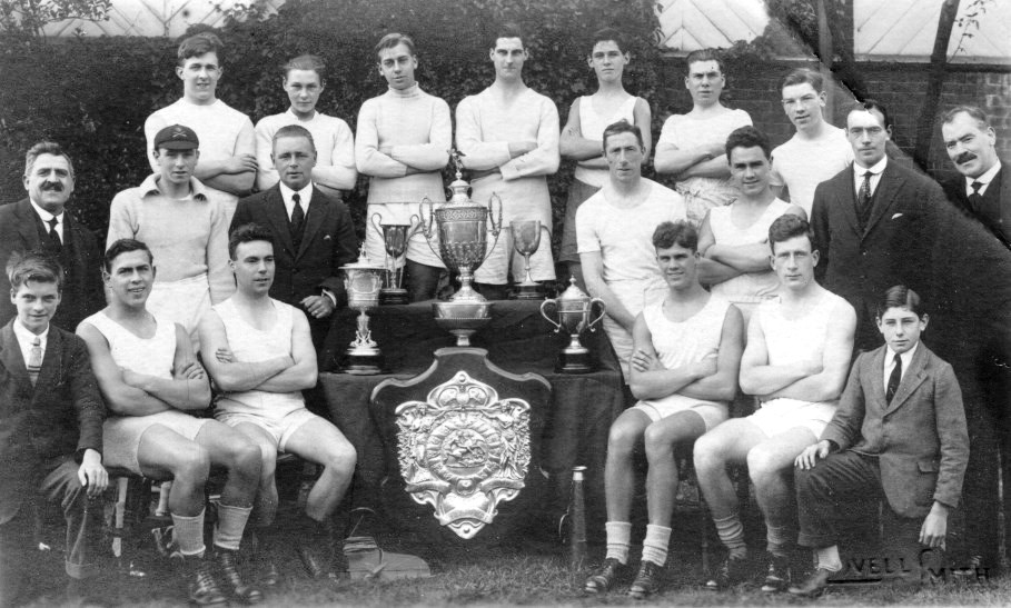 20 men and boys with many trophies